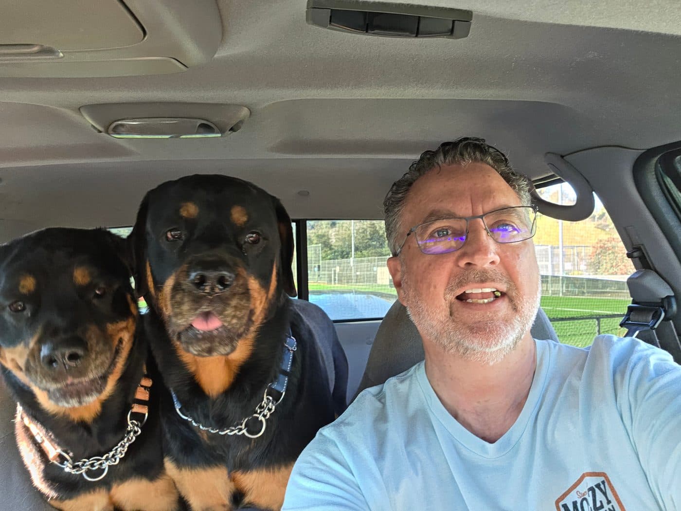 February 2025. His two Rottweilers, Brie and Ella, in the car. They requested the window seats. He obliged.