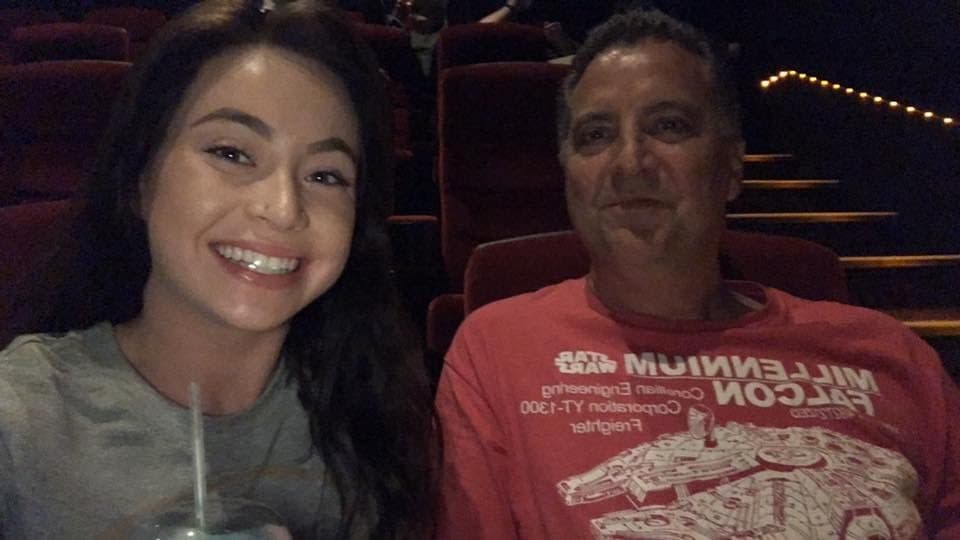 Star Wars night at the movies. He wore the Millennium Falcon shirt because he is teaching Georgia — an actual trained chef — what really matters in this world.